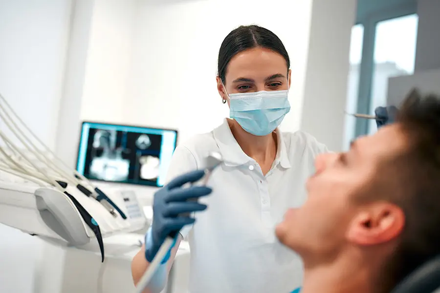 Dentist treating a patient — example of a local business benefiting from SEO and visibility in ‘near me’ searches.